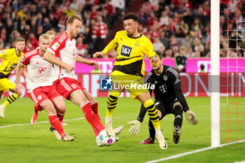 2024-03-30 - Harry Kane of Bayern Munich and Jadon Sancho of Borussia Dortmund during the German championship Bundesliga football match between Bayern Munich and Borussia Dortmund on March 30, 2024 at Allianz Arena in Munich, Germany - FOOTBALL - GERMAN CHAMP - BAYERN MUNICH V DORTMUND - GERMAN BUNDESLIGA - SOCCER