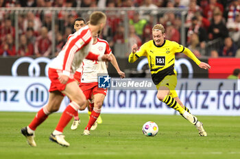 2024-03-30 - Julian Brandt of Borussia Dortmund during the German championship Bundesliga football match between Bayern Munich and Borussia Dortmund on March 30, 2024 at Allianz Arena in Munich, Germany - FOOTBALL - GERMAN CHAMP - BAYERN MUNICH V DORTMUND - GERMAN BUNDESLIGA - SOCCER