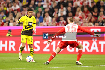 2024-03-30 - Jadon Sancho of Borussia Dortmund and Eric Dier of Bayern Munich during the German championship Bundesliga football match between Bayern Munich and Borussia Dortmund on March 30, 2024 at Allianz Arena in Munich, Germany - FOOTBALL - GERMAN CHAMP - BAYERN MUNICH V DORTMUND - GERMAN BUNDESLIGA - SOCCER