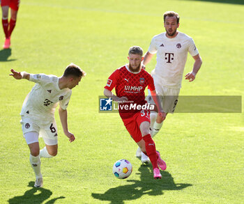 2024-04-06 - Jan-Niklas Beste of Heidenheim and Joshua Kimmich of Bayern Munich during the German championship Bundesliga football match between FC Heidenheim and FC Bayern Munich on April 6, 2024 at Voith Arena in Heidenheim, Germany - FOOTBALL - GERMAN CHAMP - HEIDENHEIM V BAYERN MUNICH - GERMAN BUNDESLIGA - SOCCER