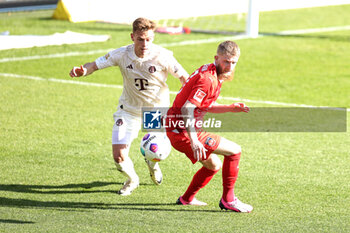 2024-04-06 - Joshua Kimmich of Bayern Munich and Jan-Niklas Beste of Heidenheim during the German championship Bundesliga football match between FC Heidenheim and FC Bayern Munich on April 6, 2024 at Voith Arena in Heidenheim, Germany - FOOTBALL - GERMAN CHAMP - HEIDENHEIM V BAYERN MUNICH - GERMAN BUNDESLIGA - SOCCER