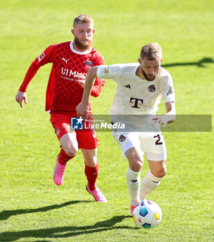 2024-04-06 - Konrad Laimer of Bayern Munich and Jan-Niklas Beste of Heidenheim during the German championship Bundesliga football match between FC Heidenheim and FC Bayern Munich on April 6, 2024 at Voith Arena in Heidenheim, Germany - FOOTBALL - GERMAN CHAMP - HEIDENHEIM V BAYERN MUNICH - GERMAN BUNDESLIGA - SOCCER