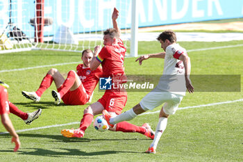 2024-04-06 - Thomas Müller of Bayern Munich and Patrick Mainka of Heidenheim during the German championship Bundesliga football match between FC Heidenheim and FC Bayern Munich on April 6, 2024 at Voith Arena in Heidenheim, Germany - FOOTBALL - GERMAN CHAMP - HEIDENHEIM V BAYERN MUNICH - GERMAN BUNDESLIGA - SOCCER