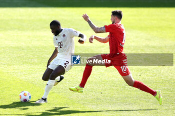 2024-04-06 - Dayot Upamecano of Bayern Munich and Tim Kleindienst of Heidenheim during the German championship Bundesliga football match between FC Heidenheim and FC Bayern Munich on April 6, 2024 at Voith Arena in Heidenheim, Germany - FOOTBALL - GERMAN CHAMP - HEIDENHEIM V BAYERN MUNICH - GERMAN BUNDESLIGA - SOCCER