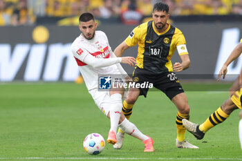 2024-04-06 - Deniz Undav of Stuttgart and Emre Can of Borussia Dortmund during the German championship Bundesliga football match between Borussia Dortmund and VfB Stuttgart on April 6, 2024 at Signal Iduna Park in Dortmund , Germany - FOOTBALL - GERMAN CHAMP - DORTMUND V STUTTGART - GERMAN BUNDESLIGA - SOCCER