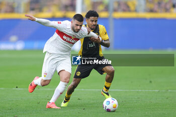 2024-04-06 - Deniz Undav of Stuttgart and Ian Maatsen of Borussia Dortmund during the German championship Bundesliga football match between Borussia Dortmund and VfB Stuttgart on April 6, 2024 at Signal Iduna Park in Dortmund , Germany - FOOTBALL - GERMAN CHAMP - DORTMUND V STUTTGART - GERMAN BUNDESLIGA - SOCCER