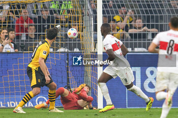 2024-04-06 - Serhou Guirassy of Stuttgart scores a goal 0-1 during the German championship Bundesliga football match between Borussia Dortmund and VfB Stuttgart on April 6, 2024 at Signal Iduna Park in Dortmund , Germany - FOOTBALL - GERMAN CHAMP - DORTMUND V STUTTGART - GERMAN BUNDESLIGA - SOCCER