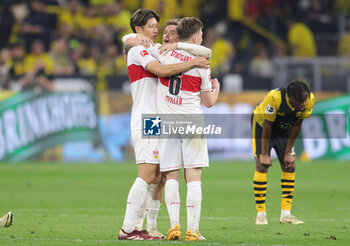 2024-04-06 - Hiroki Ito, Maximilian Mittelstädt, Angelo Stiller of Stuttgart celebrate at full time during the German championship Bundesliga football match between Borussia Dortmund and VfB Stuttgart on April 6, 2024 at Signal Iduna Park in Dortmund , Germany - FOOTBALL - GERMAN CHAMP - DORTMUND V STUTTGART - GERMAN BUNDESLIGA - SOCCER