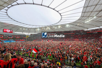 2024-04-14 - Leverkusen fans celebrate German league title 2024 following the German championship Bundesliga football match between Bayer Leverkusen and Werder Bremen on April 14, 2024 at BayArena in Leverkusen, Germany - FOOTBALL - GERMAN CHAMP - LEVERKUSEN V BREMEN - GERMAN BUNDESLIGA - SOCCER