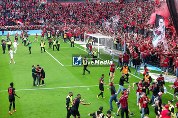 2024-04-14 - Fans of Leverkusen invade the pitch at the 83rd minute after the goal of Florian Wirtz 4-0 during the German championship Bundesliga football match between Bayer Leverkusen and Werder Bremen on April 14, 2024 at BayArena in Leverkusen, Germany - FOOTBALL - GERMAN CHAMP - LEVERKUSEN V BREMEN - GERMAN BUNDESLIGA - SOCCER