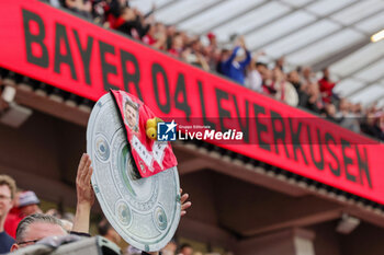 2024-04-14 - Leverkusen fans celebrate German league title 2024 following the German championship Bundesliga football match between Bayer Leverkusen and Werder Bremen on April 14, 2024 at BayArena in Leverkusen, Germany - FOOTBALL - GERMAN CHAMP - LEVERKUSEN V BREMEN - GERMAN BUNDESLIGA - SOCCER