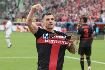 2024-04-14 - Granit Xhaka of Bayer Leverkusen celebrates his goal 2-0 during the German championship Bundesliga football match between Bayer Leverkusen and Werder Bremen on April 14, 2024 at BayArena in Leverkusen, Germany - FOOTBALL - GERMAN CHAMP - LEVERKUSEN V BREMEN - GERMAN BUNDESLIGA - SOCCER