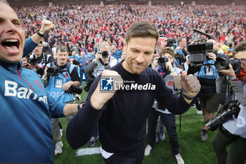 2024-04-14 - Head coach Xabi Alonso of Bayer Leverkusen celebrates German league title 2024 during the German championship Bundesliga football match between Bayer Leverkusen and Werder Bremen on April 14, 2024 at BayArena in Leverkusen, Germany - FOOTBALL - GERMAN CHAMP - LEVERKUSEN V BREMEN - GERMAN BUNDESLIGA - SOCCER