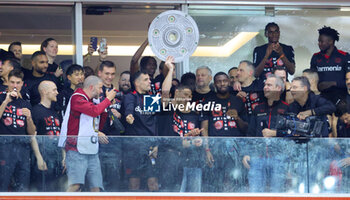 2024-04-14 - Leverkusen players and coach Xabi Alonso celebrate German league title 2024 following the German championship Bundesliga football match between Bayer Leverkusen and Werder Bremen on April 14, 2024 at BayArena in Leverkusen, Germany - FOOTBALL - GERMAN CHAMP - LEVERKUSEN V BREMEN - GERMAN BUNDESLIGA - SOCCER