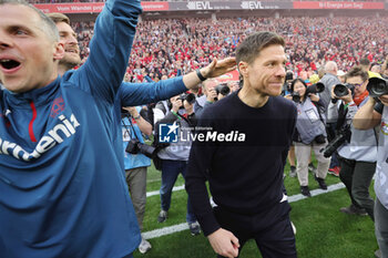 2024-04-14 - Head coach Xabi Alonso of Bayer Leverkusen celebrates German league title 2024 during the German championship Bundesliga football match between Bayer Leverkusen and Werder Bremen on April 14, 2024 at BayArena in Leverkusen, Germany - FOOTBALL - GERMAN CHAMP - LEVERKUSEN V BREMEN - GERMAN BUNDESLIGA - SOCCER