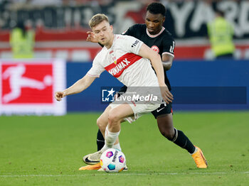 2024-04-13 - Maximilian Mittelstädt of Stuttgart and Aurelio Buta of Eintracht Frankfurt during the German championship Bundesliga football match between VfB Stuttgart and Eintracht Frankfurt on April 13, 2024 at MHPArena in Stuttgart, Germany - FOOTBALL - GERMAN CHAMP - STUTTGART V FRANKFURT - GERMAN BUNDESLIGA - SOCCER