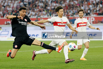 2024-04-13 - Hugo Ekitike of Eintracht Frankfurt and Hiroki Ito of Stuttgart during the German championship Bundesliga football match between VfB Stuttgart and Eintracht Frankfurt on April 13, 2024 at MHPArena in Stuttgart, Germany - FOOTBALL - GERMAN CHAMP - STUTTGART V FRANKFURT - GERMAN BUNDESLIGA - SOCCER