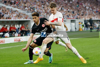 2024-04-13 - Omar Marmoush of Eintracht Frankfurt and Angelo Stiller of Stuttgart during the German championship Bundesliga football match between VfB Stuttgart and Eintracht Frankfurt on April 13, 2024 at MHPArena in Stuttgart, Germany - FOOTBALL - GERMAN CHAMP - STUTTGART V FRANKFURT - GERMAN BUNDESLIGA - SOCCER