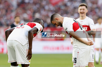 2024-04-13 - Deniz Undav (R) of Stuttgart celebrates his goal 2-0 with Serhou Guirassy during the German championship Bundesliga football match between VfB Stuttgart and Eintracht Frankfurt on April 13, 2024 at MHPArena in Stuttgart, Germany - FOOTBALL - GERMAN CHAMP - STUTTGART V FRANKFURT - GERMAN BUNDESLIGA - SOCCER