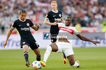 2024-04-13 - Jean-Matteo Bahoya of Eintracht Frankfurt and Serhou Guirassy of Stuttgart during the German championship Bundesliga football match between VfB Stuttgart and Eintracht Frankfurt on April 13, 2024 at MHPArena in Stuttgart, Germany - FOOTBALL - GERMAN CHAMP - STUTTGART V FRANKFURT - GERMAN BUNDESLIGA - SOCCER