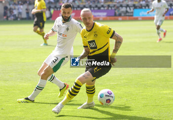 2024-04-13 - Marius Wolf of Borussia Dortmund and Franck Honorat of Borussia Mönchengladbach during the German championship Bundesliga football match between Borussia Mönchengladbach and Borussia Dortmund on April 13, 2024 at Borussia-Park in Mönchengladbach, Germany - FOOTBALL - GERMAN CHAMP - MONCHENGLADBACH V DORTMUND - GERMAN BUNDESLIGA - SOCCER