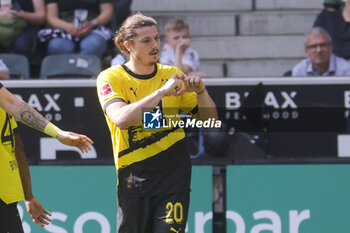 2024-04-13 - Marcel Sabitzer of Borussia Dortmund celebrates the 2-0 goal during the German championship Bundesliga football match between Borussia Mönchengladbach and Borussia Dortmund on April 13, 2024 at Borussia-Park in Mönchengladbach, Germany - FOOTBALL - GERMAN CHAMP - MONCHENGLADBACH V DORTMUND - GERMAN BUNDESLIGA - SOCCER