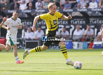 2024-04-13 - Julian Brandt of Borussia Dortmund during the German championship Bundesliga football match between Borussia Mönchengladbach and Borussia Dortmund on April 13, 2024 at Borussia-Park in Mönchengladbach, Germany - FOOTBALL - GERMAN CHAMP - MONCHENGLADBACH V DORTMUND - GERMAN BUNDESLIGA - SOCCER