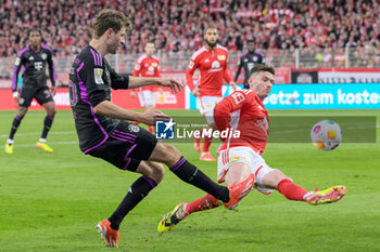 2024-04-20 - Thomas Müller of Bayern Munich and Robin Gosens of Union Berlin during the German championship Bundesliga football match between Union Berlin and Bayern Munich on April 20, 2024 at An der Alten Försterei stadium in Berlin, Germany - FOOTBALL - GERMAN CHAMP - UNION BERLIN V BAYERN MUNICH - GERMAN BUNDESLIGA - SOCCER