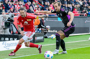 2024-04-20 - Christopher Trimmel of Union Berlin and Harry Kane of Bayern Munich during the German championship Bundesliga football match between Union Berlin and Bayern Munich on April 20, 2024 at An der Alten Försterei stadium in Berlin, Germany - FOOTBALL - GERMAN CHAMP - UNION BERLIN V BAYERN MUNICH - GERMAN BUNDESLIGA - SOCCER