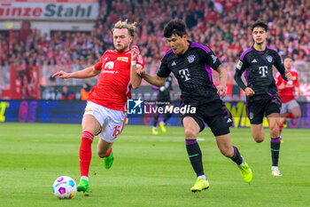 2024-04-20 - Benedict Hollerbach of Union Berlin and Min-jae Kim of Bayern Munich during the German championship Bundesliga football match between Union Berlin and Bayern Munich on April 20, 2024 at An der Alten Försterei stadium in Berlin, Germany - FOOTBALL - GERMAN CHAMP - UNION BERLIN V BAYERN MUNICH - GERMAN BUNDESLIGA - SOCCER