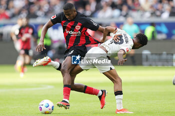 2024-05-05 - Willian Pacho of Frankfurt and Nathan Tella of Leverkusen during the German championship Bundesliga football match between Eintracht Frankfurt and Bayer 04 Leverkusen on May 5, 2024 at Deutsche Bank Park in Frankfurt, Germany - FOOTBALL - GERMAN CHAMP - FRANKFURT V LEVERKUSEN - GERMAN BUNDESLIGA - SOCCER