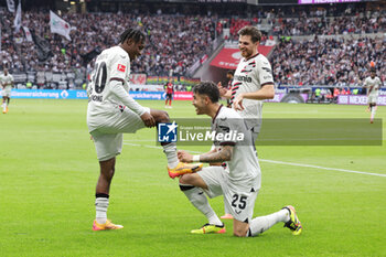 2024-05-05 - Jeremie Frimpong of Leverkusen celebrates his goal 1-4 with Exequiel Palacios during the German championship Bundesliga football match between Eintracht Frankfurt and Bayer 04 Leverkusen on May 5, 2024 at Deutsche Bank Park in Frankfurt, Germany - FOOTBALL - GERMAN CHAMP - FRANKFURT V LEVERKUSEN - GERMAN BUNDESLIGA - SOCCER