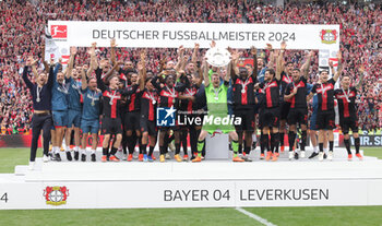 2024-05-18 - Bayer Leverkusen players celebrating the German championship title after the German championship Bundesliga football match between Bayer 04 Leverkusen and FC Augsburg on May 18, 2024 at BayArena in Leverkusen, Germany - FOOTBALL - GERMAN CHAMP - LEVERKUSEN V AUGSBURG - GERMAN BUNDESLIGA - SOCCER