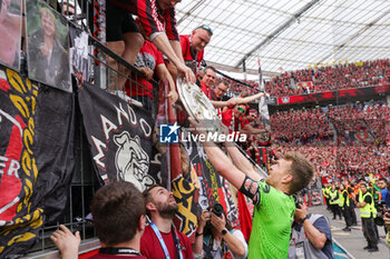 2024-05-18 - Bayer Leverkusen fans with goalkeeper Lukas Hradecky celebrating the German championship title after the German championship Bundesliga football match between Bayer 04 Leverkusen and FC Augsburg on May 18, 2024 at BayArena in Leverkusen, Germany - FOOTBALL - GERMAN CHAMP - LEVERKUSEN V AUGSBURG - GERMAN BUNDESLIGA - SOCCER