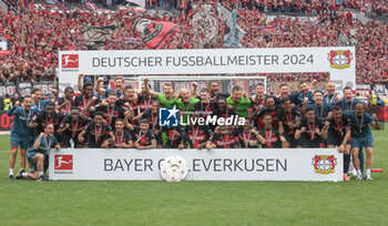 2024-05-18 - Bayer Leverkusen players celebrating the German championship title after the German championship Bundesliga football match between Bayer 04 Leverkusen and FC Augsburg on May 18, 2024 at BayArena in Leverkusen, Germany - FOOTBALL - GERMAN CHAMP - LEVERKUSEN V AUGSBURG - GERMAN BUNDESLIGA - SOCCER