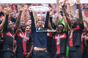 2024-05-18 - Bayer Leverkusen players with head coach Xabi Alonso celebrating the German championship title after the German championship Bundesliga football match between Bayer 04 Leverkusen and FC Augsburg on May 18, 2024 at BayArena in Leverkusen, Germany - FOOTBALL - GERMAN CHAMP - LEVERKUSEN V AUGSBURG - GERMAN BUNDESLIGA - SOCCER