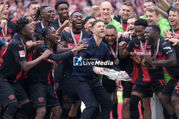 2024-05-18 - Bayer Leverkusen players with head coach Xabi Alonso celebrating the German championship title after the German championship Bundesliga football match between Bayer 04 Leverkusen and FC Augsburg on May 18, 2024 at BayArena in Leverkusen, Germany - FOOTBALL - GERMAN CHAMP - LEVERKUSEN V AUGSBURG - GERMAN BUNDESLIGA - SOCCER