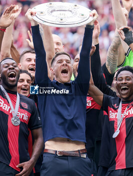 2024-05-18 - Bayer Leverkusen players with head coach Xabi Alonso celebrating the German championship title after the German championship Bundesliga football match between Bayer 04 Leverkusen and FC Augsburg on May 18, 2024 at BayArena in Leverkusen, Germany - FOOTBALL - GERMAN CHAMP - LEVERKUSEN V AUGSBURG - GERMAN BUNDESLIGA - SOCCER