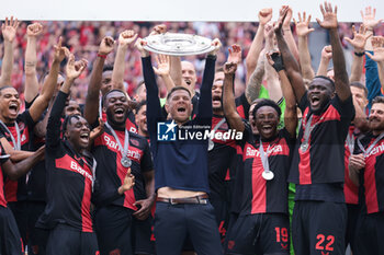 2024-05-18 - Bayer Leverkusen players with head coach Xabi Alonso celebrating the German championship title after the German championship Bundesliga football match between Bayer 04 Leverkusen and FC Augsburg on May 18, 2024 at BayArena in Leverkusen, Germany - FOOTBALL - GERMAN CHAMP - LEVERKUSEN V AUGSBURG - GERMAN BUNDESLIGA - SOCCER