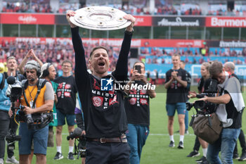 2024-05-18 - Bayer Leverkusen head coach Xabi Alonso celebrates the German championship title after the German championship Bundesliga football match between Bayer 04 Leverkusen and FC Augsburg on May 18, 2024 at BayArena in Leverkusen, Germany - FOOTBALL - GERMAN CHAMP - LEVERKUSEN V AUGSBURG - GERMAN BUNDESLIGA - SOCCER