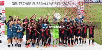 2024-05-18 - Bayer Leverkusen players celebrating the German championship title after the German championship Bundesliga football match between Bayer 04 Leverkusen and FC Augsburg on May 18, 2024 at BayArena in Leverkusen, Germany - FOOTBALL - GERMAN CHAMP - LEVERKUSEN V AUGSBURG - GERMAN BUNDESLIGA - SOCCER