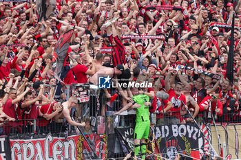 2024-05-18 - Bayer Leverkusen fans with goalkeeper Lukas Hradecky celebrating the German championship title after the German championship Bundesliga football match between Bayer 04 Leverkusen and FC Augsburg on May 18, 2024 at BayArena in Leverkusen, Germany - FOOTBALL - GERMAN CHAMP - LEVERKUSEN V AUGSBURG - GERMAN BUNDESLIGA - SOCCER