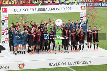 2024-05-18 - Bayer Leverkusen players celebrating the German championship title after the German championship Bundesliga football match between Bayer 04 Leverkusen and FC Augsburg on May 18, 2024 at BayArena in Leverkusen, Germany - FOOTBALL - GERMAN CHAMP - LEVERKUSEN V AUGSBURG - GERMAN BUNDESLIGA - SOCCER