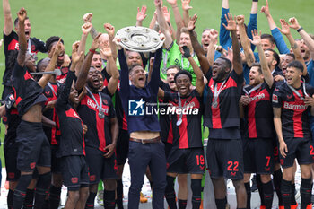 2024-05-18 - Bayer Leverkusen players with head coach Xabi Alonso celebrating the German championship title after the German championship Bundesliga football match between Bayer 04 Leverkusen and FC Augsburg on May 18, 2024 at BayArena in Leverkusen, Germany - FOOTBALL - GERMAN CHAMP - LEVERKUSEN V AUGSBURG - GERMAN BUNDESLIGA - SOCCER