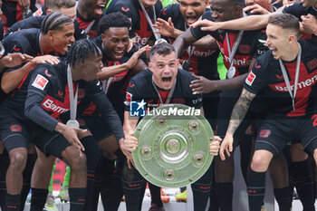 2024-05-18 - Bayer Leverkusen players with Granit Xhaka celebrating the German championship title after the German championship Bundesliga football match between Bayer 04 Leverkusen and FC Augsburg on May 18, 2024 at BayArena in Leverkusen, Germany - FOOTBALL - GERMAN CHAMP - LEVERKUSEN V AUGSBURG - GERMAN BUNDESLIGA - SOCCER