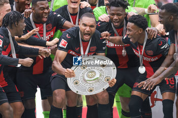 2024-05-18 - Bayer Leverkusen players with Jonathan Tah celebrating the German championship title after the German championship Bundesliga football match between Bayer 04 Leverkusen and FC Augsburg on May 18, 2024 at BayArena in Leverkusen, Germany - FOOTBALL - GERMAN CHAMP - LEVERKUSEN V AUGSBURG - GERMAN BUNDESLIGA - SOCCER