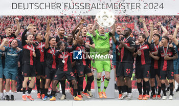 2024-05-18 - Bayer Leverkusen players with Lukas Hradecky celebrating the German championship title after the German championship Bundesliga football match between Bayer 04 Leverkusen and FC Augsburg on May 18, 2024 at BayArena in Leverkusen, Germany - FOOTBALL - GERMAN CHAMP - LEVERKUSEN V AUGSBURG - GERMAN BUNDESLIGA - SOCCER