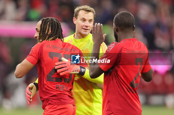 2024-11-22 - Sacha Boey, Manuel Neuer, Dayot Upamecano of Bayern Munich at full time during the German championship Bundesliga football match between Bayern Munich and Augsburg on 22 November 2024 at Allianz Arena in Munich, Germany - FOOTBALL - GERMAN CHAMP - BAYERN MUNICH V AUGSBURG - GERMAN BUNDESLIGA - SOCCER