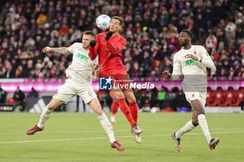 2024-11-22 - Jeffrey Gouweleeuw of Augsburg and Leon Goretzka of Bayern Munich during the German championship Bundesliga football match between Bayern Munich and Augsburg on 22 November 2024 at Allianz Arena in Munich, Germany - FOOTBALL - GERMAN CHAMP - BAYERN MUNICH V AUGSBURG - GERMAN BUNDESLIGA - SOCCER