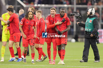 2024-11-22 - Thomas Müller, Dayot Upamecano of Bayern Munich at full time during the German championship Bundesliga football match between Bayern Munich and Augsburg on 22 November 2024 at Allianz Arena in Munich, Germany - FOOTBALL - GERMAN CHAMP - BAYERN MUNICH V AUGSBURG - GERMAN BUNDESLIGA - SOCCER